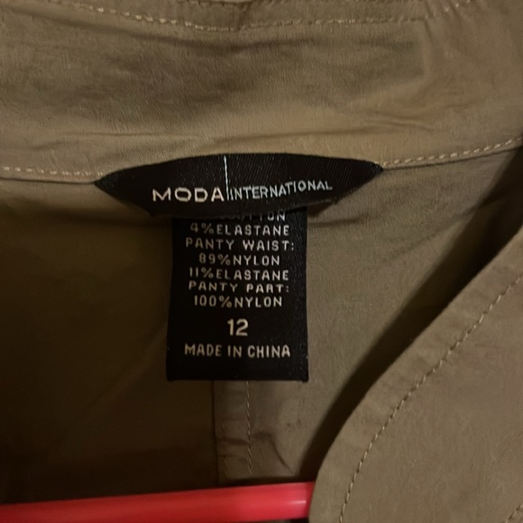 Moda International, sleeveless olive zip up body suit with lace bottoms. - Picture 4 of 6